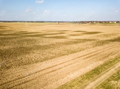 Preview: Drone Image. Aerial View Of Wet Cultivated Agriculture Fields Near Jaunpils In Latvia With Tractor