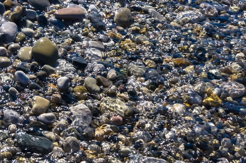 Preview: Sea Pebble Beach With Multicoloured Stones, Transparent Waves With Foam, On A Warm Summer Day