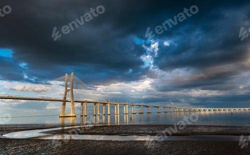 Preview: Vasco Da Gama Bridge At Sunset With Dramatic Cloudy Sky In Lisbon Portugal