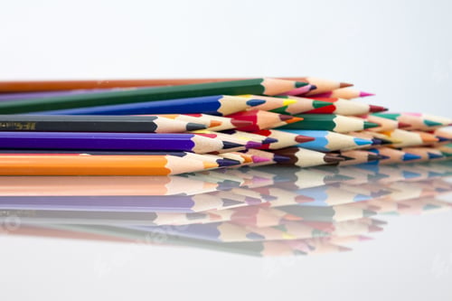 Preview: Group Of Sharp Colored Pencils With White Background And Reflexions