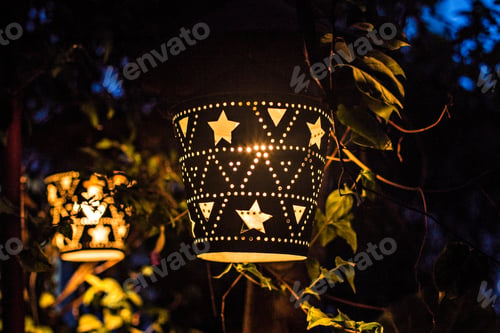 Preview: Wooden Carved Illuminated Lamp At Night