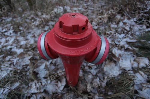 Preview: Close Up Of A Red Fire Hydrant With White Lines, Outdoors On A Winter Day In Poland, Europe