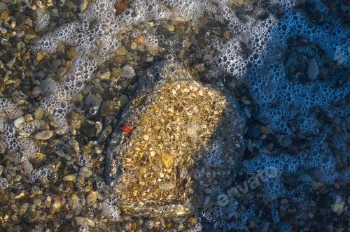Preview: Sea Pebble Beach With Multicoloured Stones, Transparent Waves With Foam, On A Warm Summer Day