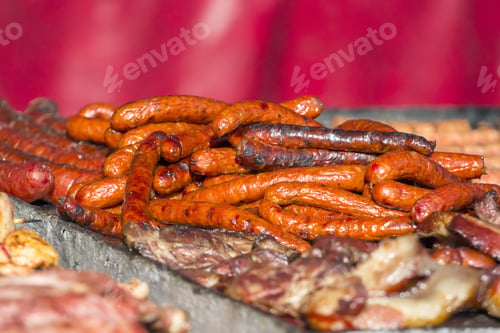 Preview: Different Kind On Grilled Meat And Sausages With Smoke And Steam From The Grill