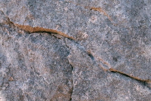 Preview: The Texture Of A Large Stone, Part Of A Rock On A Sunny Day. Close-Up. Macro