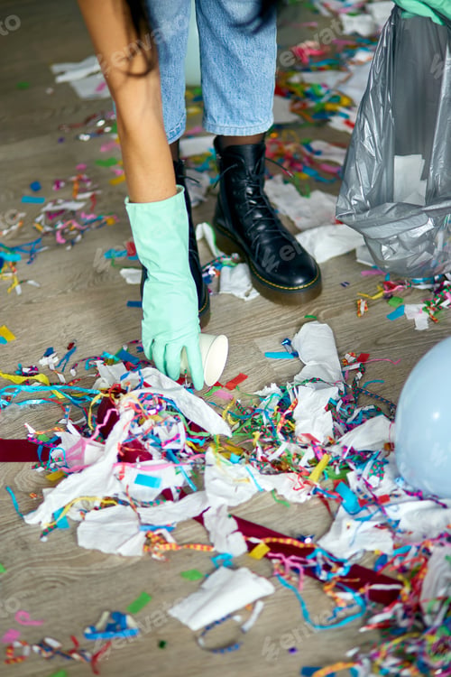Preview: Woman Cleaning Mess Of Floor In Room After Party, Removes Garbage From The Floor, Disposable Cups