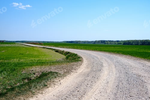 Preview: Beautiful Wavy Gravel Road In Countryside Sunny Summer Day