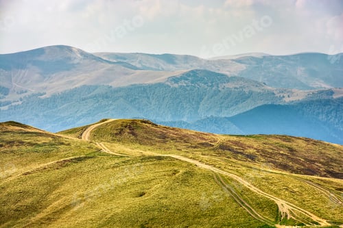 Preview: Winding Road Through Large Meadows On The Hillside Of Carpathian Mountain Range