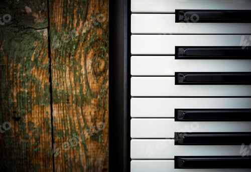 Preview: Piano Keyboard On The Old Wooden Planks Background Closeup