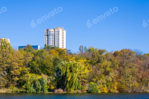 Preview: Autumn Urban Landscape On A Sunny Day - Yellow Autumn Trees In The Park, River, And Bright Sky With
