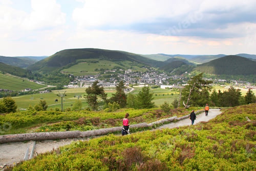 Preview: 3 People Walking Downhill Into The Valley And Village
