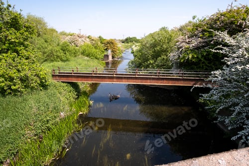 Preview: Metal Footbridge Spanning A Small River