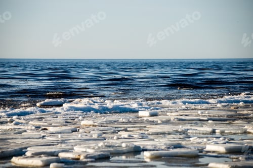 Preview: Frozen Beach In Cold Winters Day With Colorful Sky And Ice