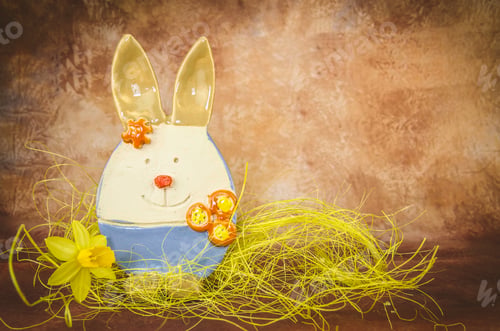 Preview: Colorful Easter Bunny And Daffodil Decoration Against Dark Brown Background