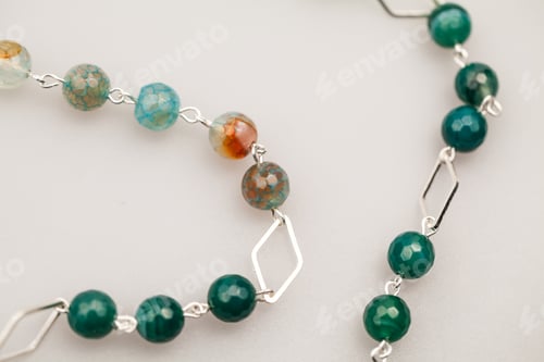 Preview: Silver Jewels With Colorful Precious Stones And Light Grey Background