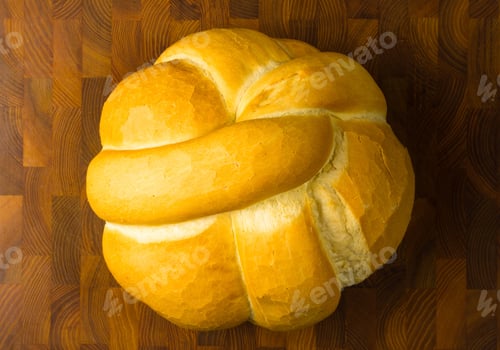 Preview: Fresh Braided Loaf Of White Wheat Bread On Wooden Background