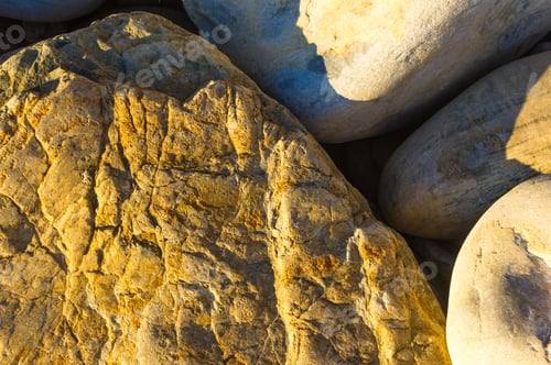 Preview: Boulders And Colorful Pebbles On The Beach On A Warm Summer Day