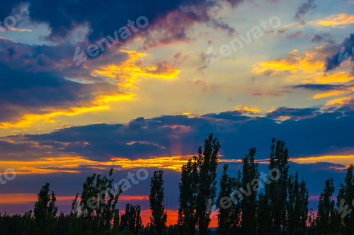Preview: Landscape With Dramatic Light - Orange Clouds And The Outline Of Trees At Sunset
