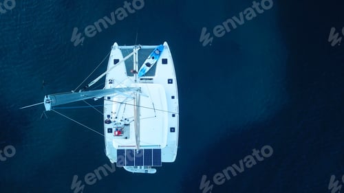 Preview: Aerial Drone Bird'S Eye View Photo Of Catamaran Docked In Deep Blue Sea