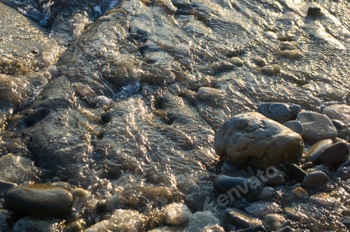 Preview: Pebble Stones On The Sea Beach On A Warm Summer Day, The Rolling Waves Of The Blue Sea With White