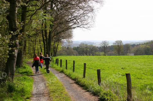 Preview: Family Walking Over Dirt Road Through Fenced Pastures