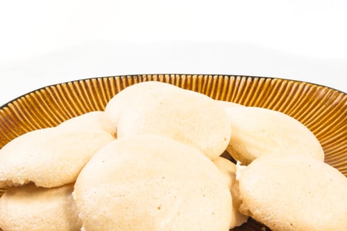 Preview: Brown Plate With Meringues On A White Background
