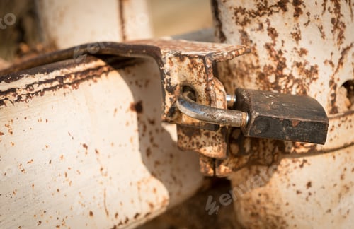 Preview: Metal Rusty Padlock Securing A Closed Metal Gate.