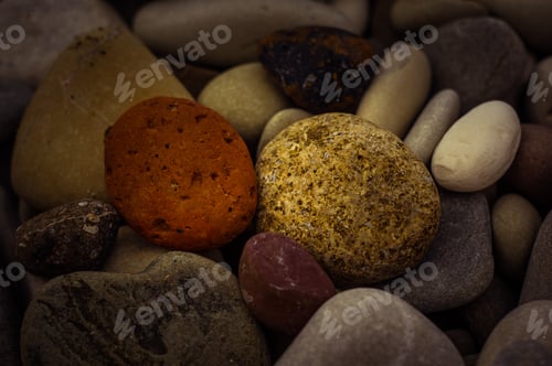 Preview: Boulders And Colorful Pebbles On The Beach