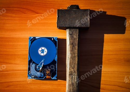 Preview: Opened Hard Disk Drive On The Table With The Old Hammer