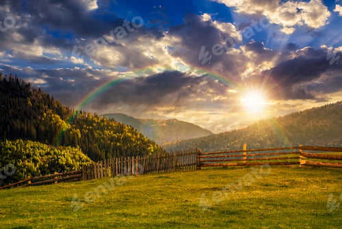 Preview: Wooden Fence Through The Grassy Meadow In Mountains. Beautiful Carpathian Countryside Landscape