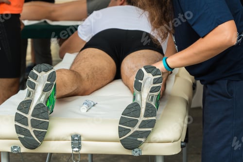 Preview: Athlete Receiving Massage on Legs From Therapist