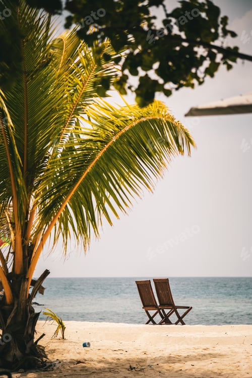 Preview: Two Empty Chairs By The Sea On The Beach In Maldives