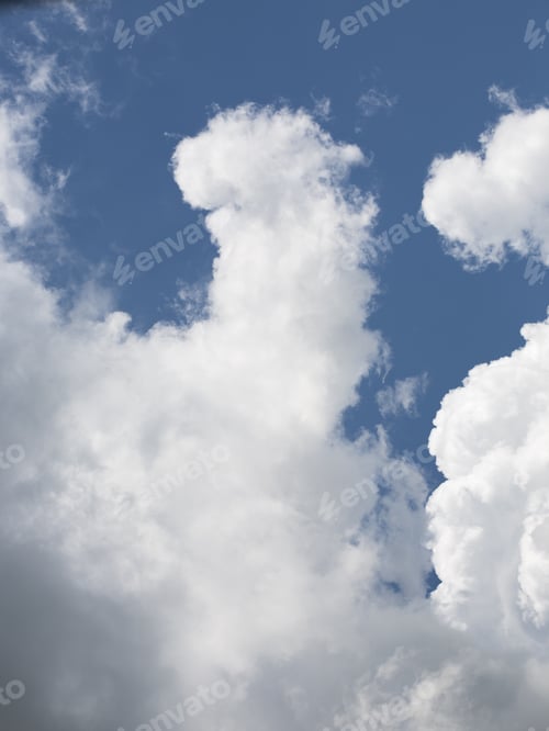 Preview: Beautiful, Fluffy, White And Grey Clouds And Blue Sky
