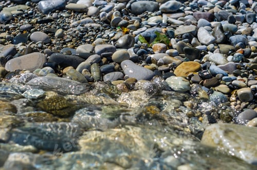 Preview: Pebble Stones On The Sea Beach, The Rolling Waves Of The Sea With Foam