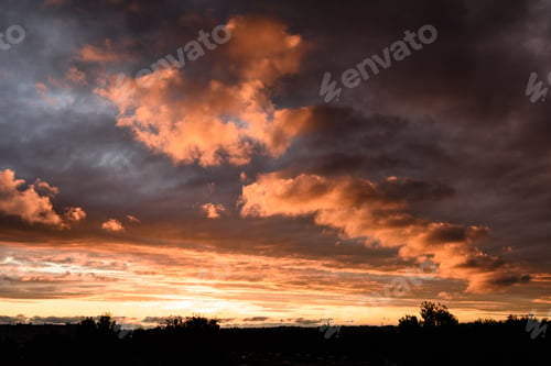 Preview: Dramatic Red And Black Clouds In Sunset Over City Rooftops
