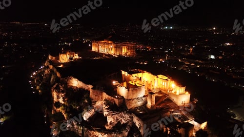 Preview: Aerial Birds Eye View Night Shot Taken By Drone Of Iconic Acropolis Hill, Propylaia And The