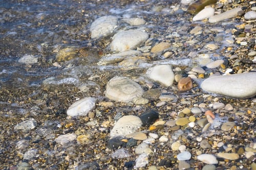Preview: Sea Pebble Beach With Multicoloured Stones, Transparent Waves With Foam, On A Warm Summer Day