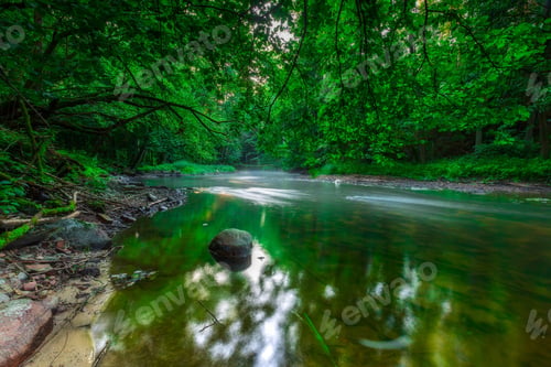 Preview: Beautiful Wild River In Summertime Green Forest Photographed At Sunrise. River Wadag Near Olsztyn