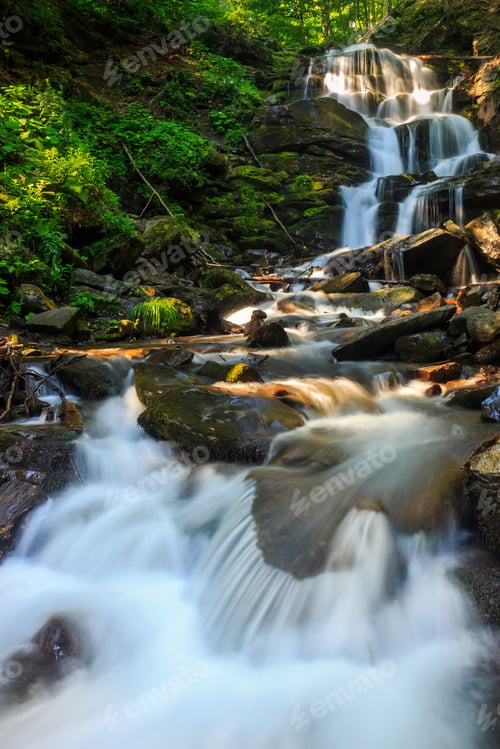 Preview: Incredibly Beautiful And Clean Little Waterfall With Several Cascades Over Large Stones In The