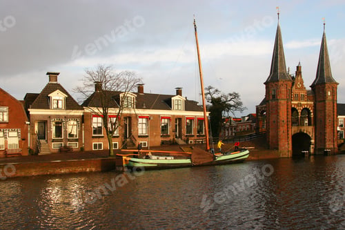 Preview: Sailors Moving Historical Boat At Quay Near Water Gate Entrance Of Fortified City