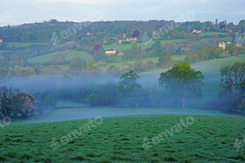Preview: A Misty Start To The Day Over The Cotswold Escarpment In An Area Of Outstanding Natural Beauty And
