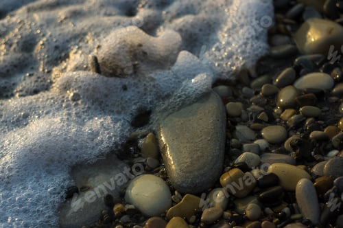 Preview: Pebble Stones On The Sea Beach, The Rolling Waves Of The Sea With Foam