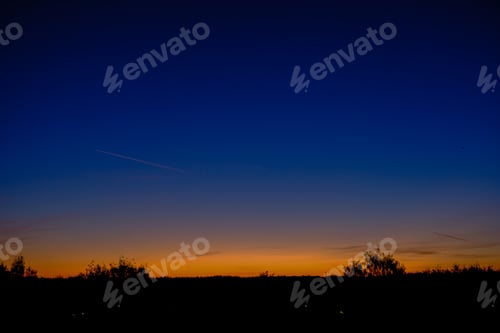 Preview: Dramatic Sunrise Over The Calm Country Side Trees In Forest. Latvia