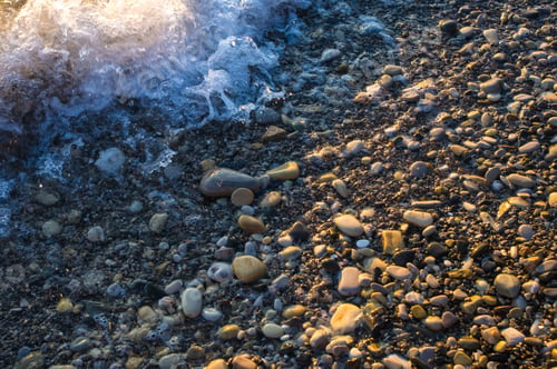 Preview: Sea Pebble Beach With Multicoloured Stones, Transparent Waves With Foam, On A Warm Evening