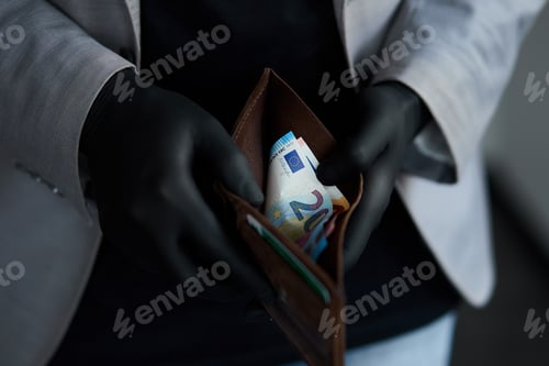 Preview: Man Holding A Wallet With Money Euro In Hand In Black Medical Gloves. Coronavirus Crisis. Save