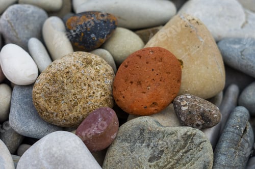 Preview: Boulders And Colorful Pebbles On The Beach