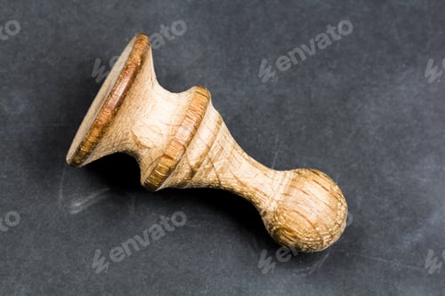 Preview: Wooden Sculpture with Textured Surface on Dark Background