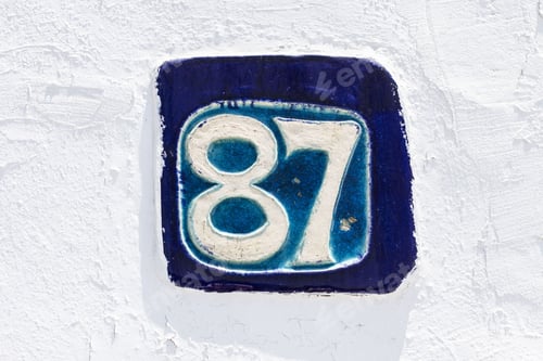 Preview: Blue Tile With Number 87 On White Wall Background