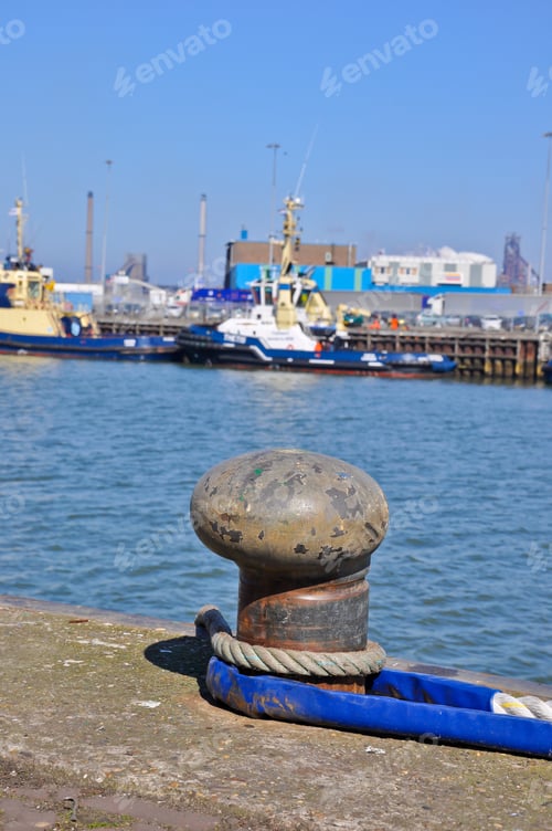 Preview: Old Bollard With Attached Ropes In In The Fishing Port Of The City Of Ijmuiden In The Netherlands.