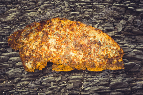 Preview: Very Rusty Metal On A Gray Cracked Rock
